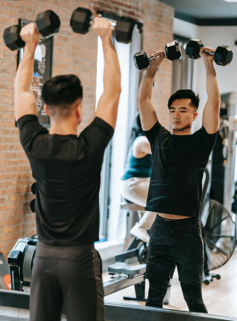 Devil Press – Overhead Dumbbell – Image by Andres Ayrton Pexels.com