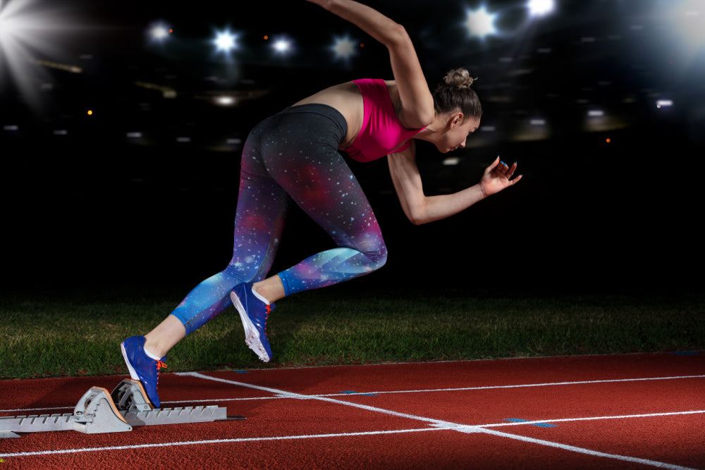 Athlete Sprinting at night—Image from Shutterstock