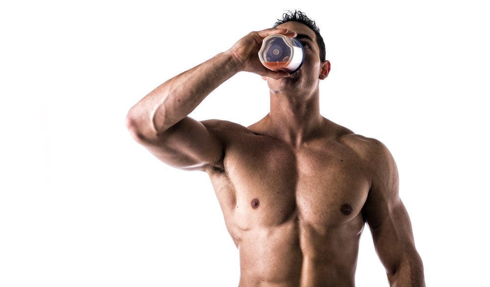 Strong man drinking protein shake