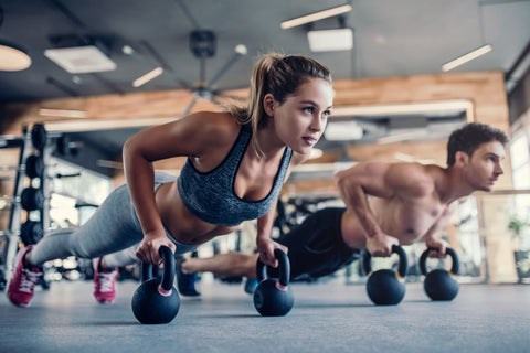 Man and woman doing push ups