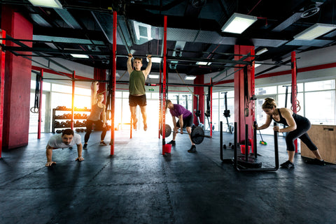 Muscular athletes training in a fitness studio Functional training workout in a gym