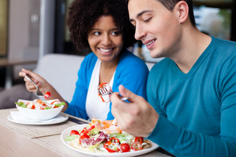 Teenagers eating.