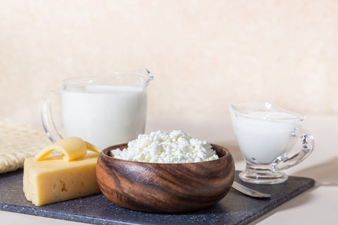 Dairy products on the table: cottage cheese, sour cream, milk, cheese, contain casein, albumin, globulin, lactose