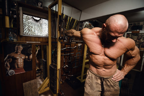 man doing doorway biceps stretch