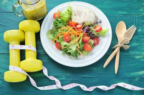 Fresh salad, fruits with sport and diet concept