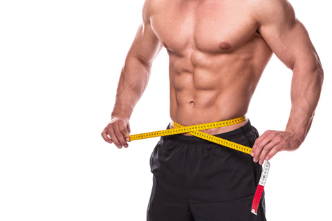 Male torso and measuring tape on white background