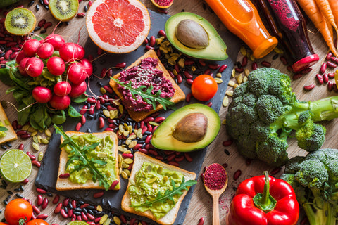 Healthy vegan food. Fresh vegetables on wooden background.