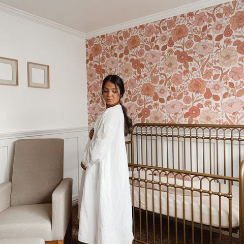 a pregnant woman in her baby room