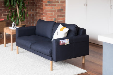 The All Day Sofa in a living room, with a side pocket for extra storage