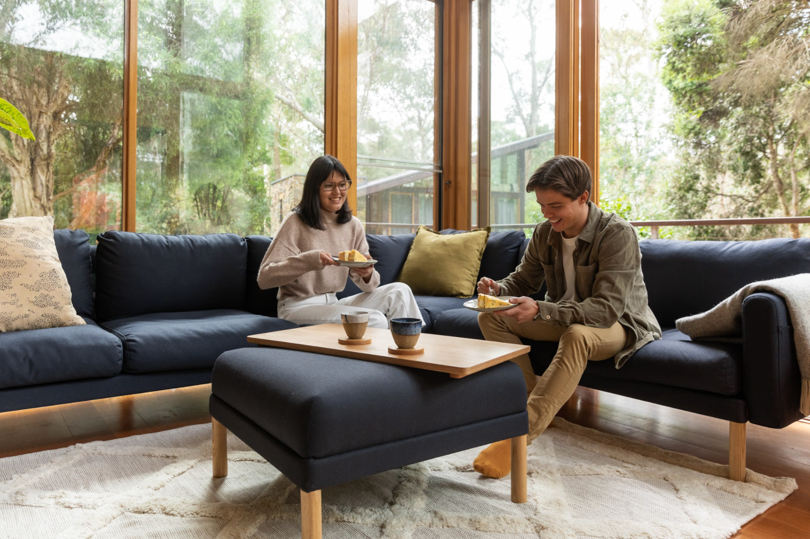 Woman and man sitting on All Day Sofa