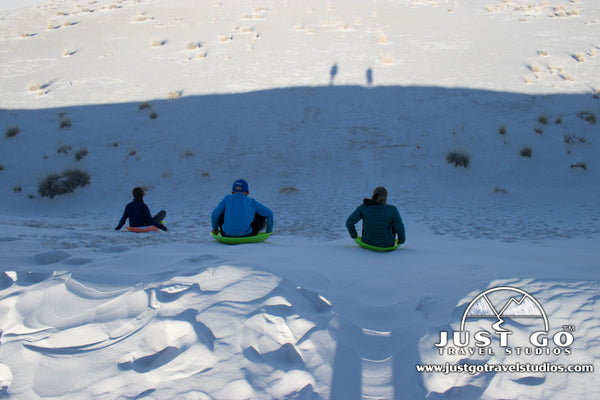 sledding in White Sands National Monument