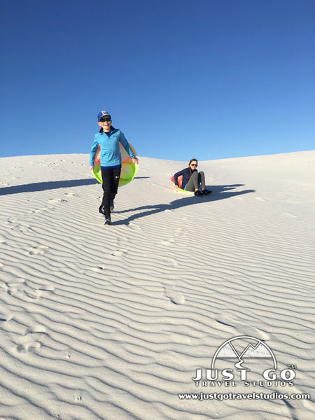 playing on the sand in White Sands National Monument