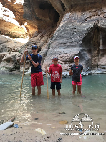 Hiking the narrows with hiking poles in Zion National Park