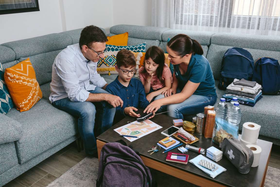 family huddled preparing for an emergency 