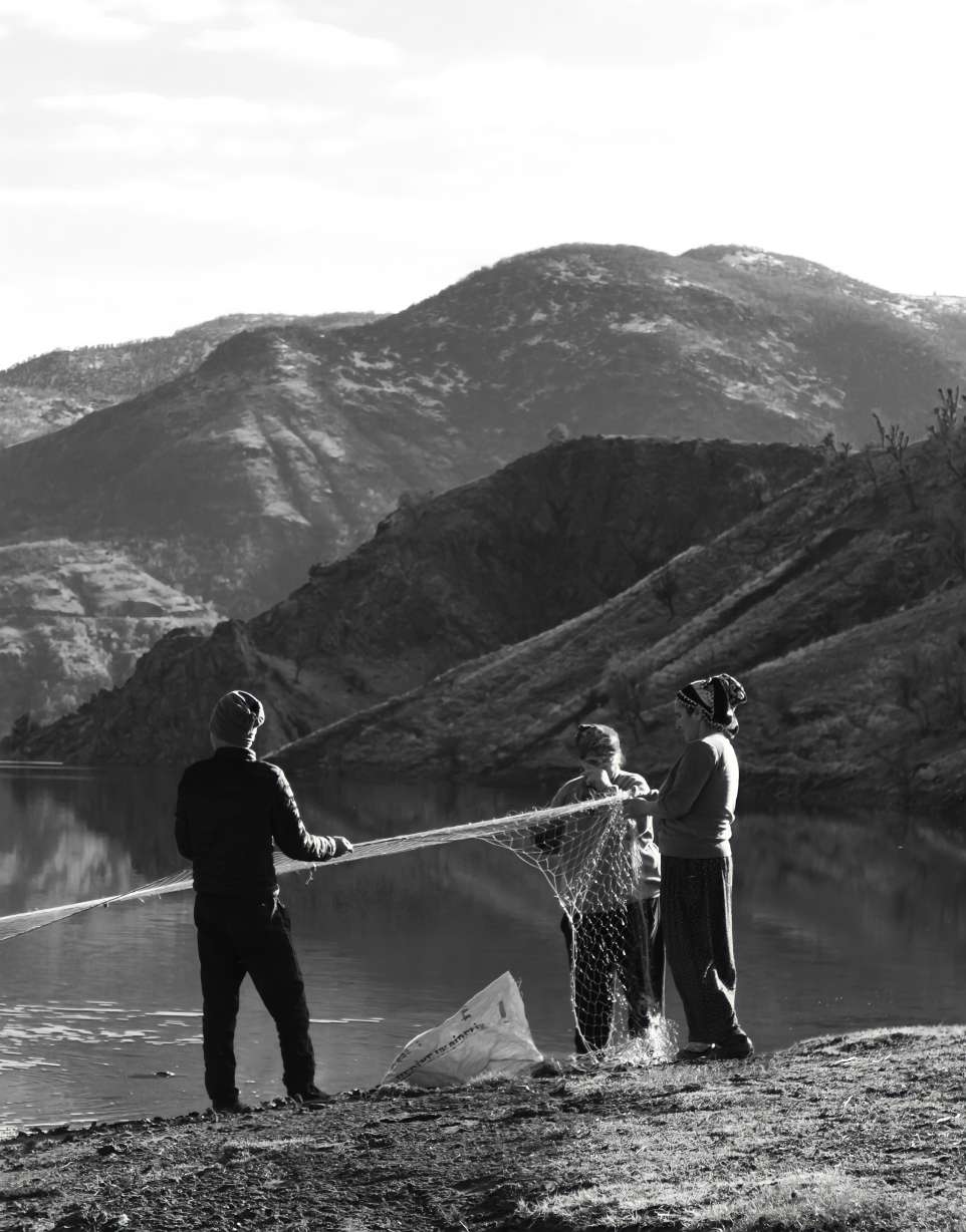 group of survivalists working together fishing net