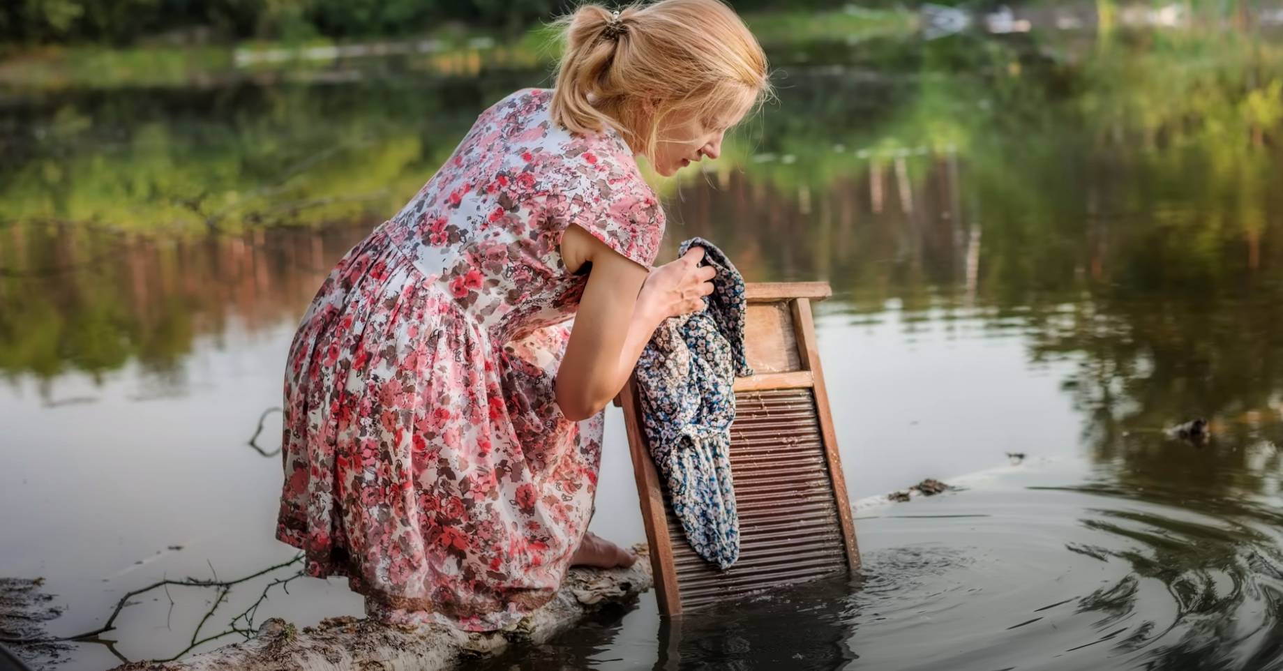 washboard to clean clothes in a lake