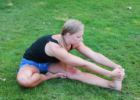 Woman stretching her hamstrings