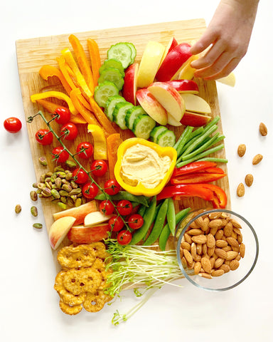 Healthy snack fruit vegetables nuts hummus