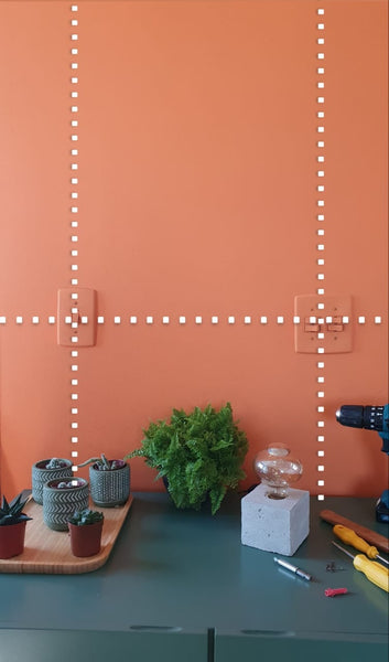 como perforar una regla de pared de la cruz