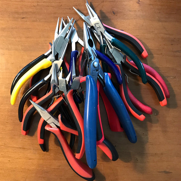 Pile of jewelry making pliers