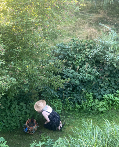 Estyn Hulbert weeding in garden