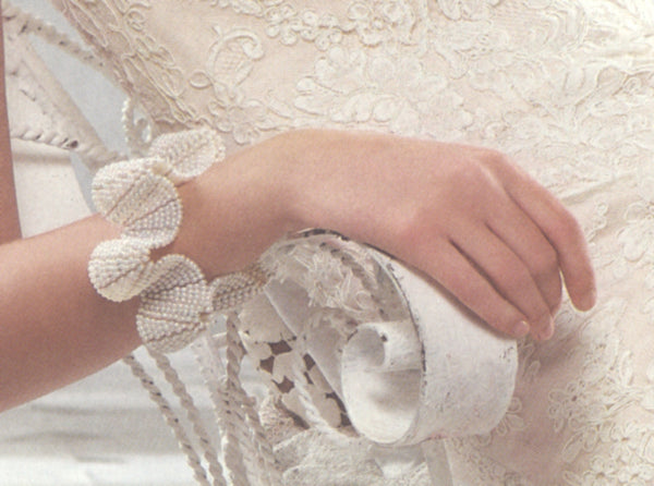 Detail of pearl Flower cuff by Estyn Hulbert in Martha Stewart Weddings