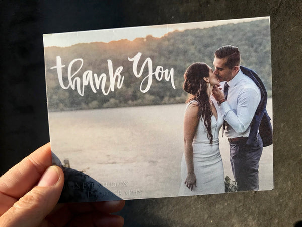 Wedding thank you note with photo of couple kissing