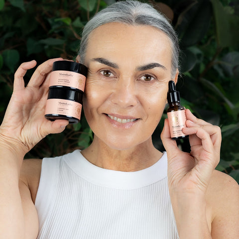 Woman holding Restorative Trio products