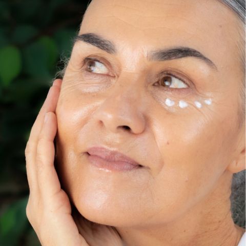 Image of a woman with Restorative Eye Cream