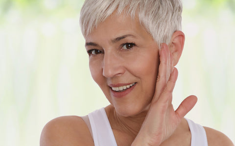 Homemade Face masks - Mature woman smiling with clear skin.