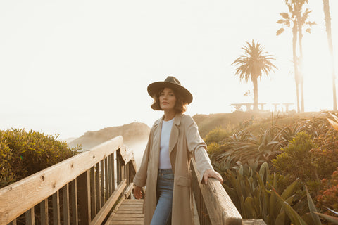 Fall/winter wool felt hat collection photoshoot in Laguna Beach, California featuring the Kiss Me Fedora in charcoal