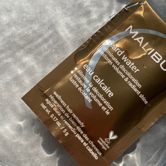 Malibu C Hard Water Treatment single use sachet for discoloured pink hair on holiday