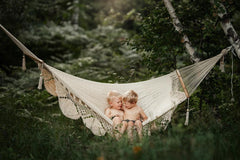 kids on a hammock in the forest