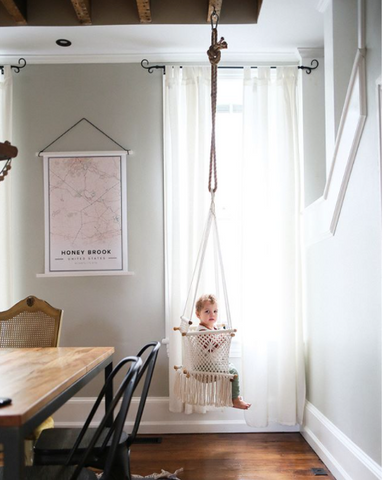 baby swing chair in a dinner room