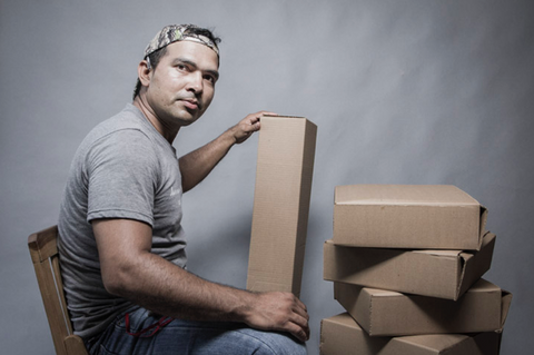 Artisan Miguel with the cardboard boxes he made - hang a hammock collective