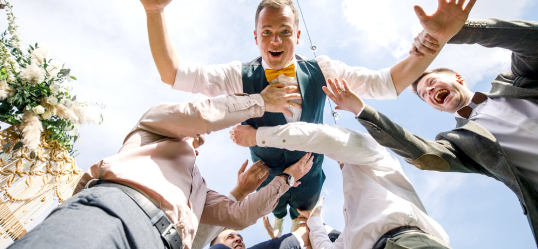 Groomsmen having fun on wedding day