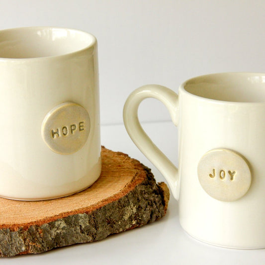 https://cdn.shopify.com/s/files/1/1886/6123/products/hopeandjoymugs5.jpg?v=1652993370&width=533