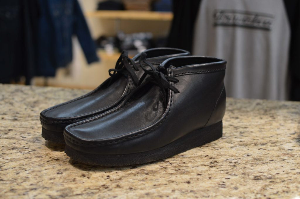 black leather wallabees