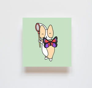 A print of a corgi holding a net and a holding up a purple butterfly on a mint green background
