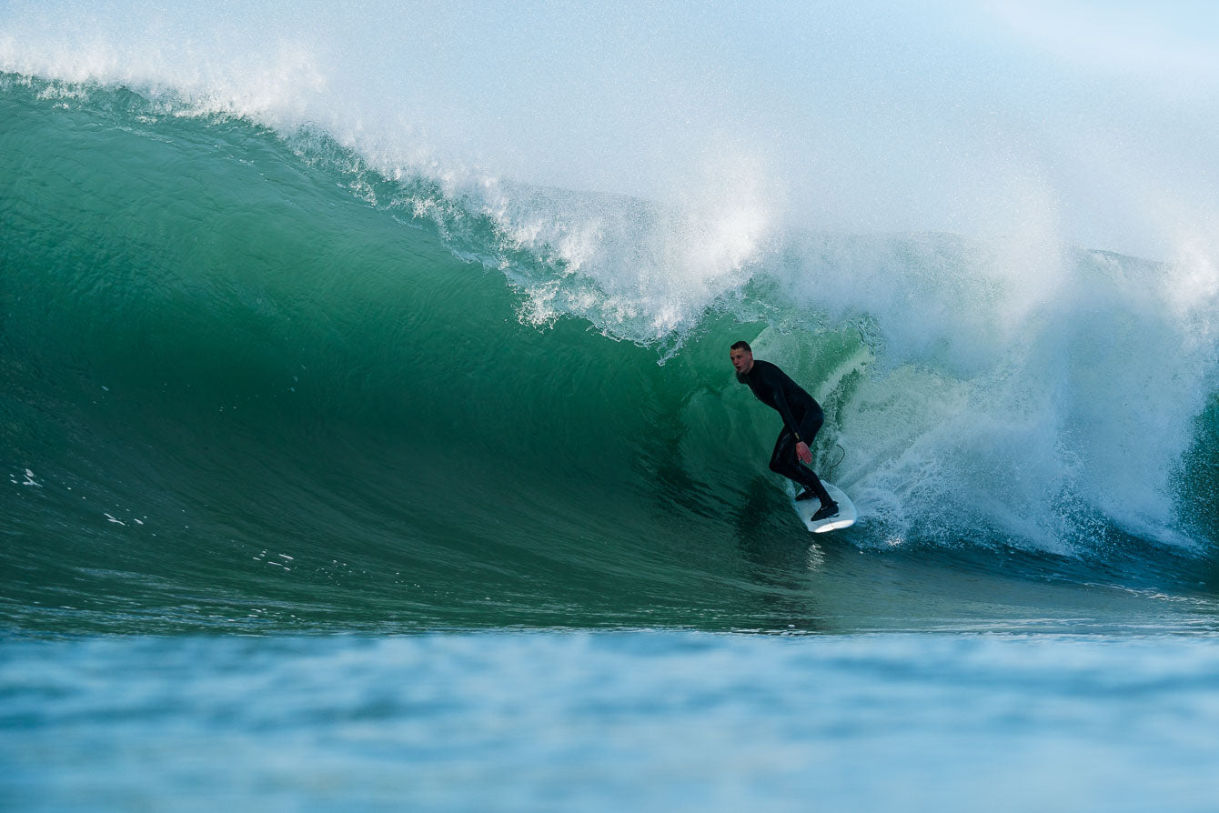 Winter surfing in Porthleven Cornwall by Laurie McCall Art and Photography