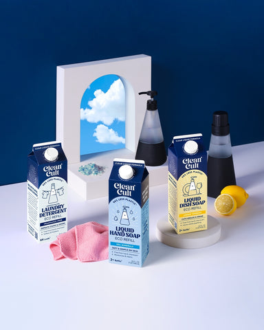 Clean Cult cleaning products and soap dispensers on a blue background