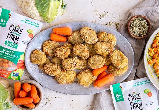 homemade chicken nuggets, on a tray with carrots and cauliflower, and next to Once Upon a Farm Plant-Rich Meal packaging