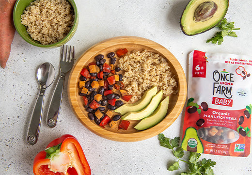 black bean and red pepper meal with quinoa and avocado on a plate