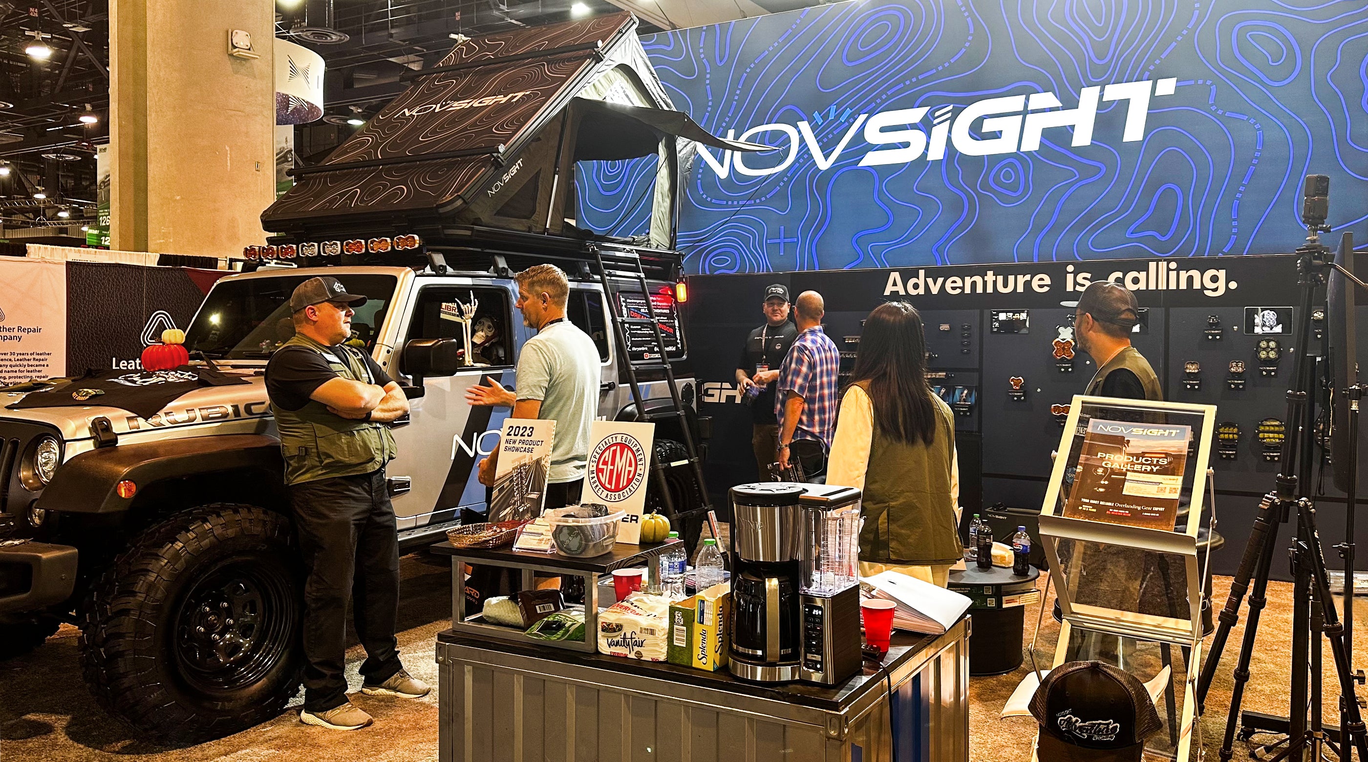 novsight booth that a car decorated with a skull driver and a pumpkin lantern.
