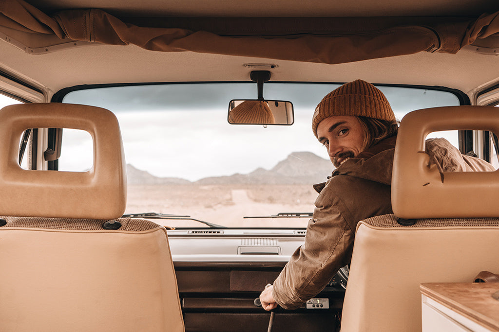 Will & Bear co-founder Alexander Knorr drives vintage van wearing Levi Mustard Beanie