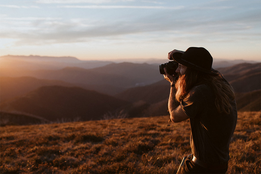 Joel Aston of EXSPD photography workshops wears Will & Bear wide brim hat whilst capturing the sunset 