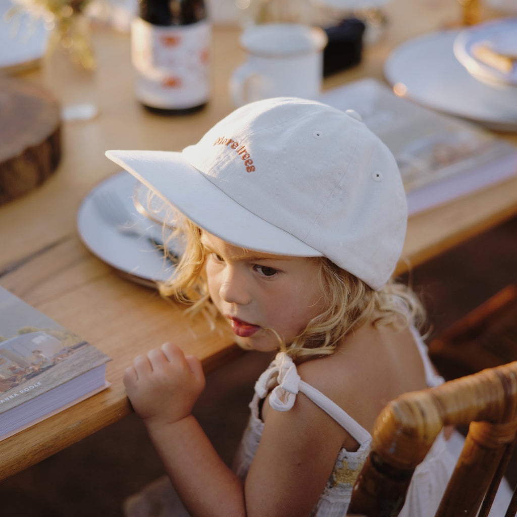 Girl wear kids hat at camp