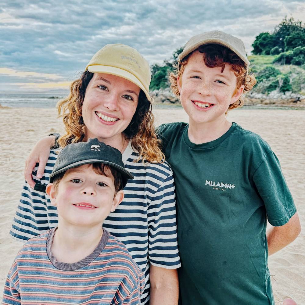 Family camping at the beach wearing Will & Bear caps