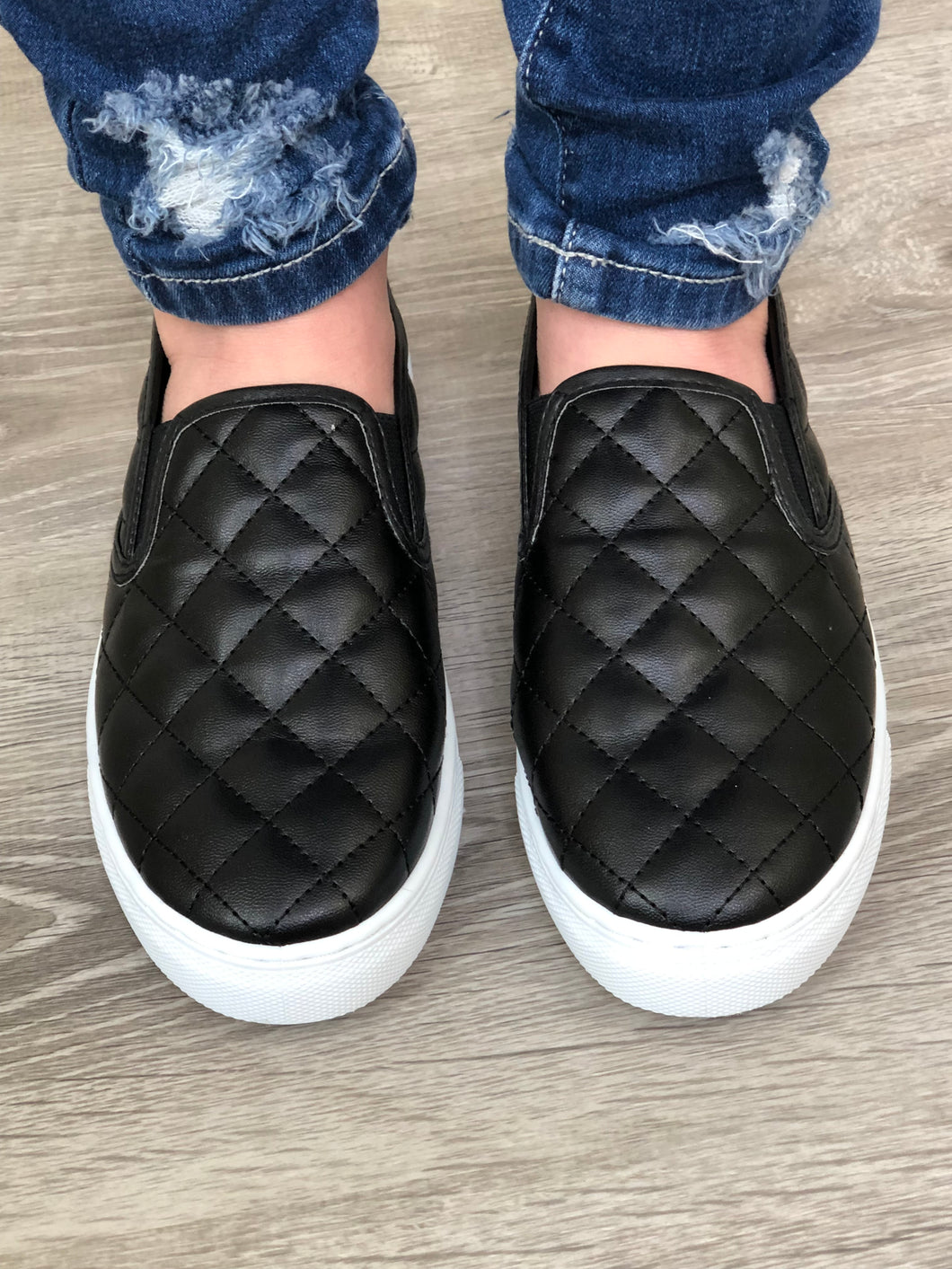 black quilted slip on shoes