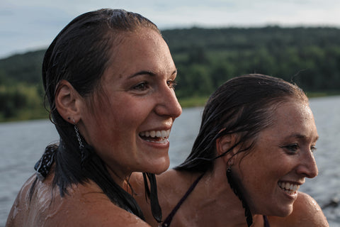 Devin and Alix wearing ABD rubber adventure jewelry swimming in Blueberry lake, VT.